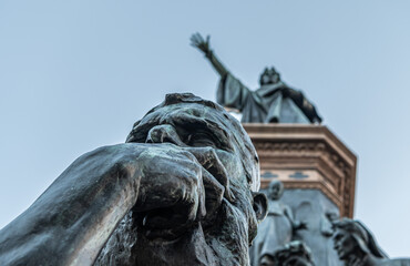 Trento city: Details of the  sculptural group dedicated to Dante Alighieri, by the Florentine sculptor Cesare Zocchi (1851 - 1922), located in the park of the station of Trento - Trentino  - iTALY