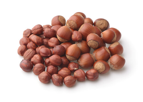 Pile of shelled and unshelled hazelnuts