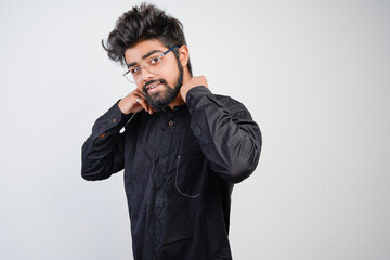 young indian man in black kurta isolated on gray