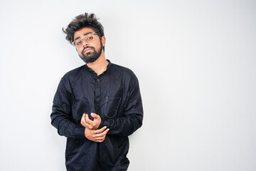 young indian man in black kurta isolated on gray