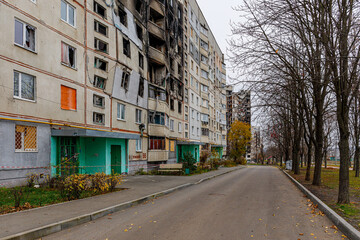 Fototapeta na wymiar Residential area Saltovka, Kharkiv, Ukraine - autumn 2022: Destroyed apartment as a result of an artillery shell hit. War in Ukraine.
