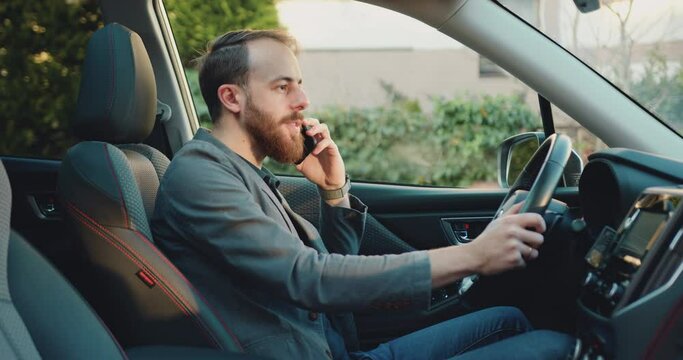 Young man driver calling, using phone. concept, vehicle and transport. Confident Businessman is talking on smarthone sitting in modern car.