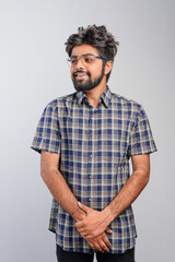 Young Indian businessman against white background