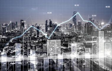 Financial graphs and digital indicators overlap with modernistic urban area, skyscrabber for stock market business concept. Double exposure.