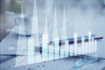 Forex graph hologram on table with computer background. Double exposure. Concept of financial markets.