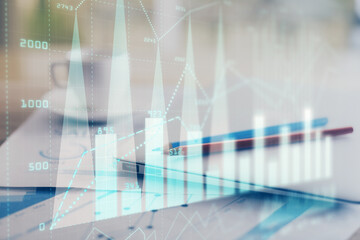 Forex graph hologram on table with computer background. Double exposure. Concept of financial markets.