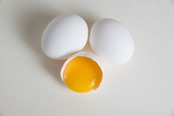 Eggs and egg yolk in shell isolate on white background