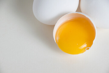 Eggs and egg yolk in shell isolate on white background - obrazy, fototapety, plakaty