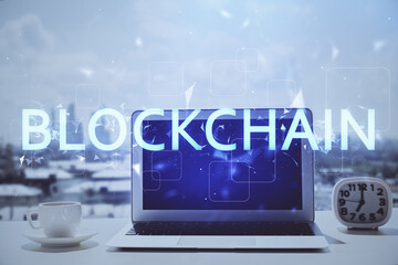 Double exposure of blockchain and crypto economy theme hologram and table with computer background....