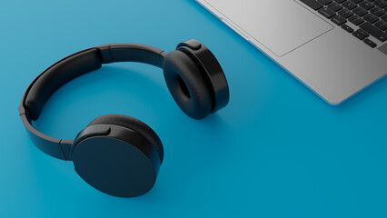 headphones and laptop on blue background