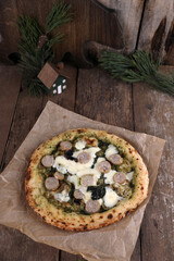 Neapolitan pizza with sausage and pesto