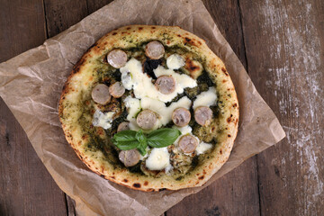Neapolitan pizza with sausage and pesto