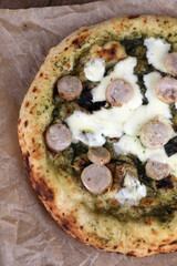 Neapolitan pizza with sausage and pesto