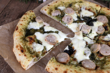 Neapolitan pizza with sausage and pesto