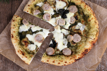 Neapolitan pizza with sausage and pesto