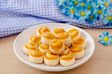 Cashew nut cookies or Singapore cookies on white plate .