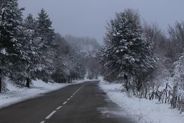 Store enrouleur occultant Hiver Snowy road in Sila Grande, Calabria, Italy