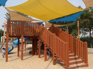 child playing in the park with sandpit design for holiday concept