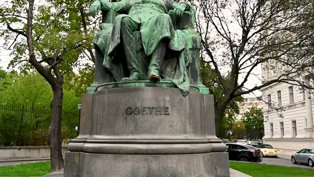 Vienna, Austria, August 2022. Slow motion footage with tilt motion of Goethe statue, Vienna, Austria, Europe.
