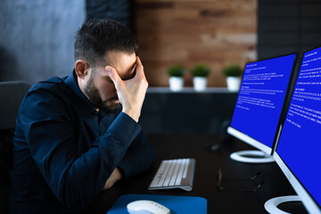 Worried Man At Computer With System Failure Screen