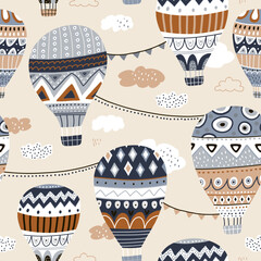Seamless pattern with hot air ballons, clouds. Trendy modern texture for fabric, wallpaper, textile, apparel. Vector illustration © solodkayamari