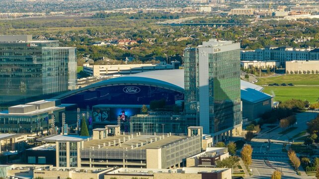 Aerial shot of  Dallas Cowboys Practice Facility surrounded by other modern urban buildings, USA