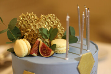 A beautiful holiday cake decorated with a bee composition. Birthday celebration.