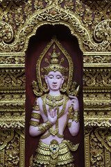 Deva statue standing in the Thai temple