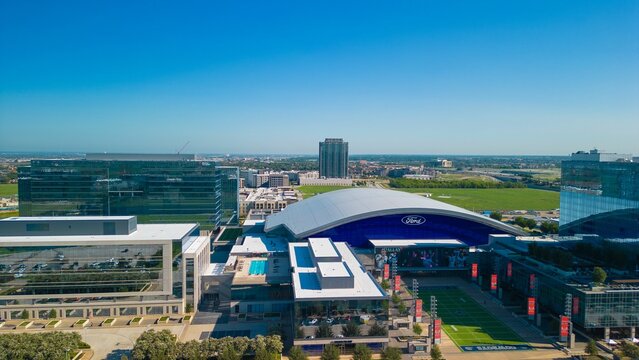 Aerial shot of  Dallas Cowboys Practice Facility surrounded by other modern urban buildings, USA