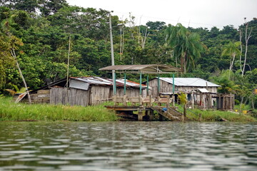 Obraz premium Houses on the bank of the river, near Pampa de Oro, Esmereldas, Ecuador