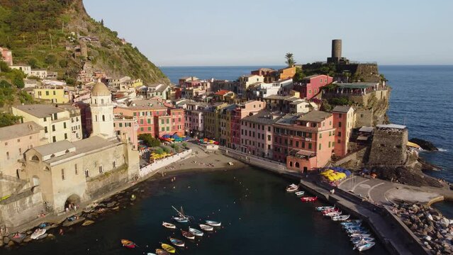 Vernazza village with typical colorful multicolored buildings houses, Castello Doria castle on rock, green hills and Genoa Gulf, Ligurian Sea, National park Cinque Terre