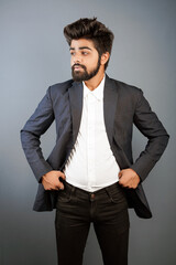 young indian business man isolated on plain, giving different poses