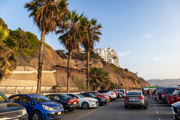 Drivers take advantage of the highway to park next to Barranco beach in Lima, Peru.
