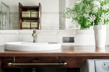 Fototapeta na wymiar Modern bathroom interior with stylish mirror and vessel sink.