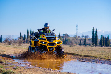 Girl driving ATV on dirt road