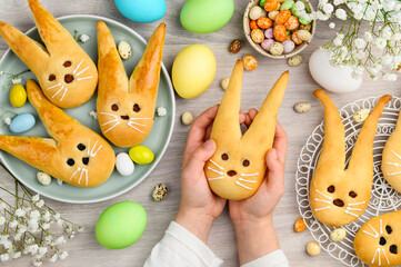 Easter bunny buns from yeast dough. Traditional Easter dessert rabbits, symbol, concept,...