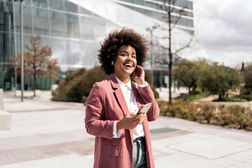 Afro Woman Walking in Business Area