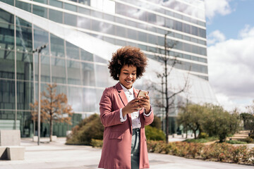 Afro Woman Walking in Business Area