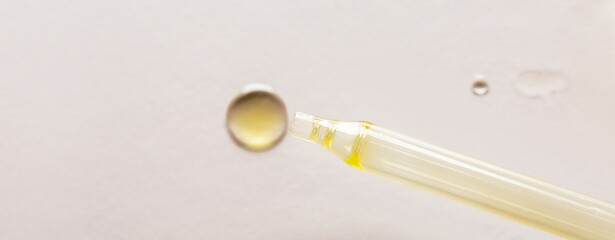 Cosmetic pipette on a white background.