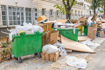 Fototapeta na wymiar Full garbage bins during a waste collection service strike in Paris, France