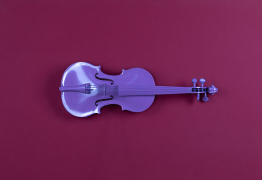 purple violin on red background