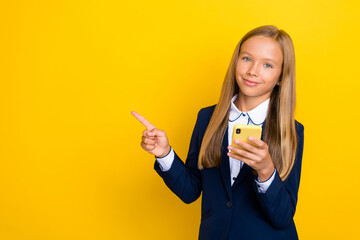 Photo of pretty cute nice girl user arm direct demonstrate cool offer proposition shopping isolated on yellow color background