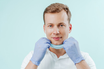 Doctor dentist smiling without medical mask in dental clinic on light background. Smile healthy teeth concept