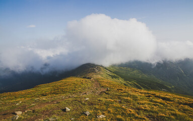 Beautifull over clouds view of Chornohora highest mountain range in Western Ukraine after the storm.