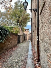 narrow street in old town of Ferrara. Italy