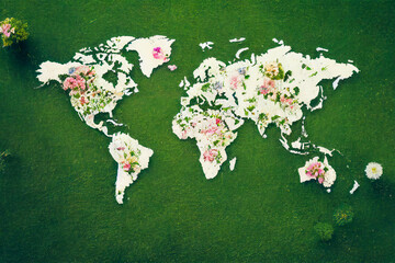 Natural world map made of flower and grass to build a healthy world without pollution, using renewable and ecological resources.