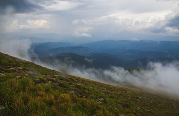 Fototapeta na wymiar Beautifull over clouds view of Chornohora highest mountain range in Western Ukraine after the storm.
