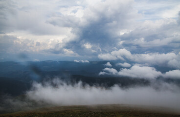 Beautifull over clouds view of Chornohora highest mountain range in Western Ukraine after the storm.