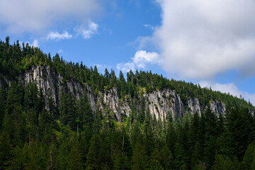 Scenic view of Rampart Ridge with sun highlighting the cliffs, Mt. Rainier National Park, WA
