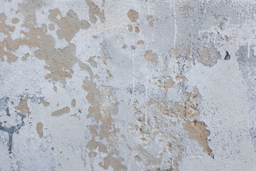White grunge old concrete stucco wall texture background. Abstract weathered peeled plaster wall with falling off flakes of paint background